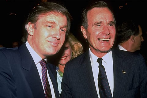 George HW Bush poses for a photo with future President Trump in 1988. Photo credit: Life magazine