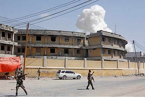 Soldiers stand on alert near the presidential palace in the capital Mogadishu.