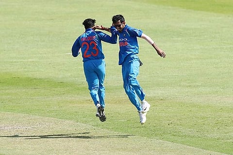 Kuldeep Yadav and Yuzvendra Chahal celebrate the fall of a South African wicket