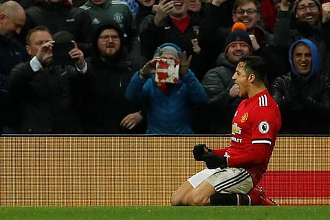 Manchester United?s Alexis Sanchez celebrates scoring their second goal against Huddersfield Town