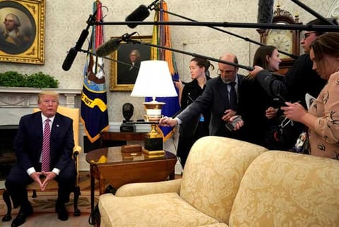 US President Donald Trump speaks to reporters in the Oval Office at the White House