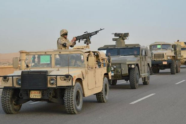 Egyptian Army's Armoured Vehicles are seen on a highway to North Sinai