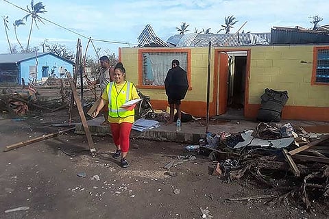 Red Cross staff inspecting the damage from Cyclone Gita