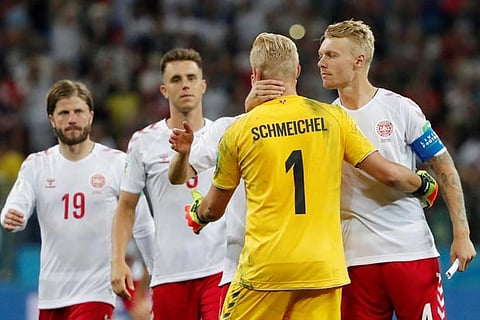 Denmark's Kasper Schmeichel and Simon Kjaer look dejected after losing the penalty shootout