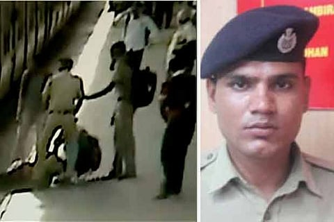 A video grab of RK Meena (right) and passengers rescuing the woman