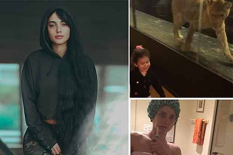 Iranian woman;Cafe lion eyes kid; Woman's bathroom selfie