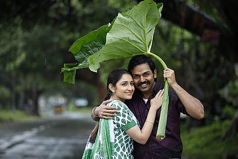 Karthi and Sayesha in the movie Kadaikutty Singam