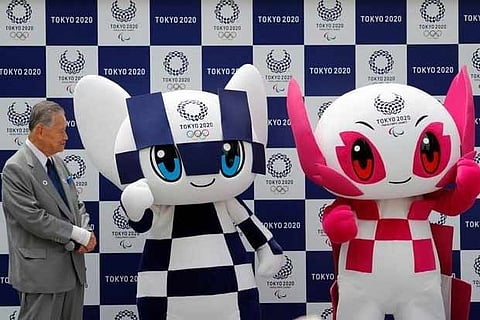 Yoshiro Mori of Tokyo 2020 Committee with Olympic mascot Miraitowa, Paralympic mascot Someity