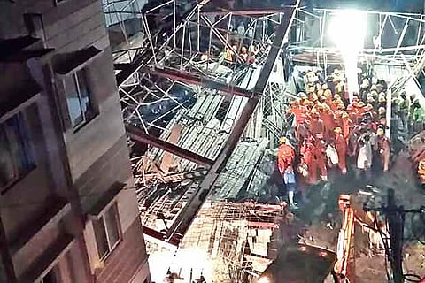 File photo of Fire and Rescue Services personnel in action at the site of the building collapse