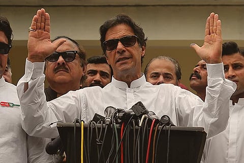 Imran Khan, chairman of Pakistan Tehreek-e-Insaf (PTI), speaks to media after casting his vote