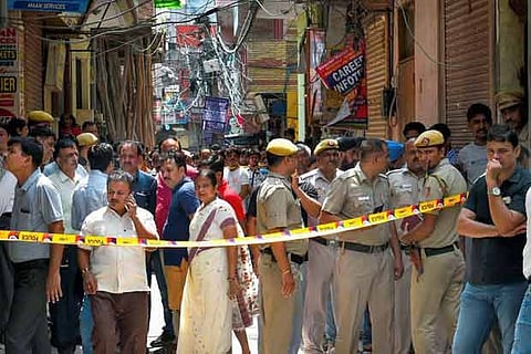 The compound leading to the house where 11 members of a family where found dead