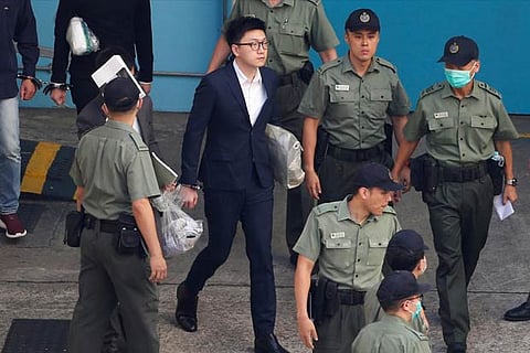 Pro-independence activist Edward Leung walks inside a detention centre