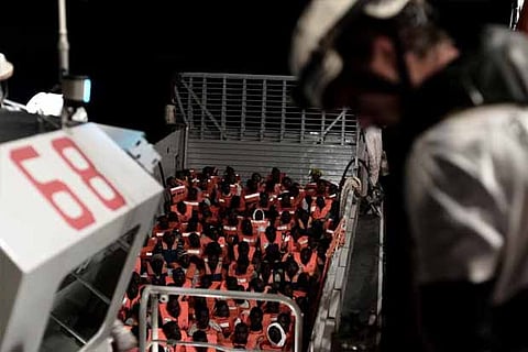 Migrants are rescued by staff members of the MV Aquarius