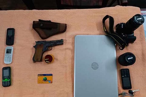 St Thomas Mount police seized a country-made pistol (inset), a laptop, few mobile phones, a DSLR cam