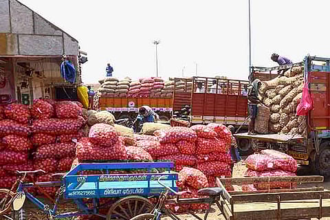 Amid the ongoing truckers? strike, onions being unloaded at the Koyambedu market in Chennai