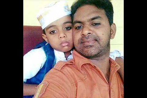 Habib Rahman with one of his sons