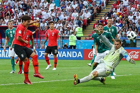 South Korea's Kim Young-gwon scores their first goal past Germany's Manuel Neuer