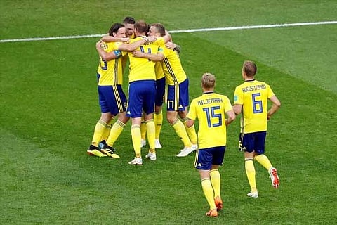 Sweden players celebrate after the match