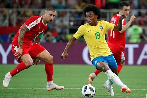 Brazil's Willian in action with Serbia's Aleksandar Kolarov.(Reuters)