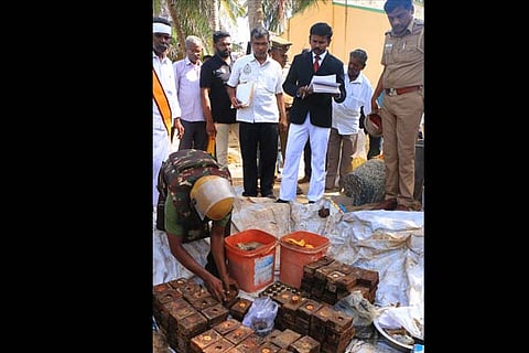 The JM inspects the weapons found in Thangachimadam