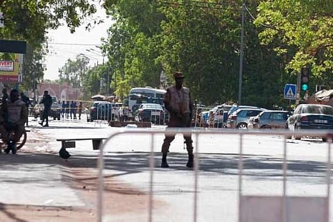 A military barrier is placed along a street leading to Burkina Faso's army headquarters