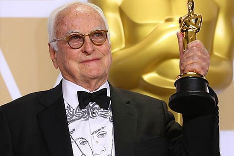 James Ivory holding his oscar