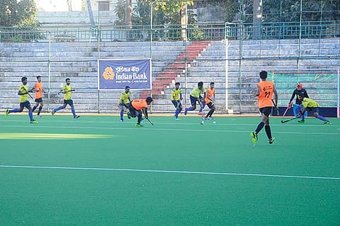 Action during the game between Indian Bank and Hockey Academy