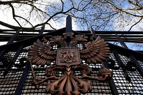 A coat of arms is seen on a gate outside of the Russian embassy in London, Britain
