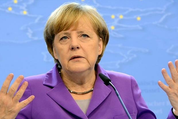 Merkel says Islam belongs to Germany, rebuffs minister's remarks