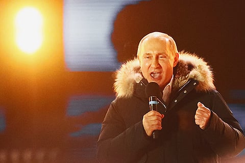 Russian President Vladimir Putin delivers a speech during a rally