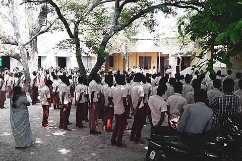 Students assemble in the old premises of the higher secondary school at Anakavoor village