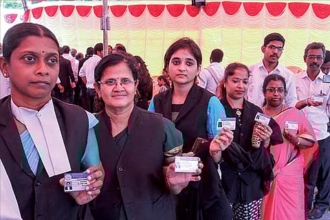 Lawyers wait to cast their votes during the election to the Bar Council of Tamil Nadu and Puducherry