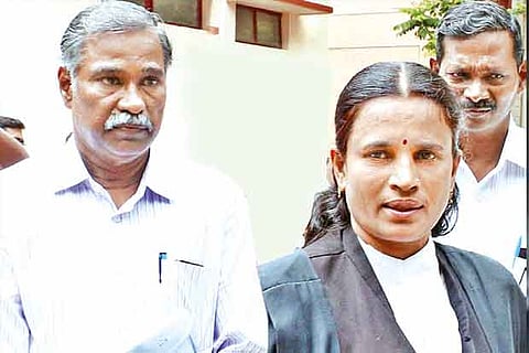 Vishnupriya?s father M Ravi (left) arrives at a court in Coimbatore on Wednesday