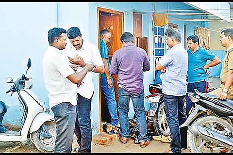 Police near a house where NIA sleuths carried out a search in the Sasikumar murder case, in Kovai