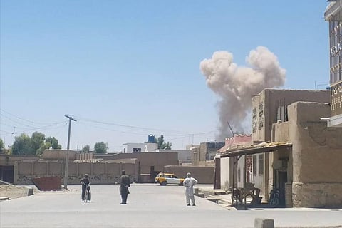 A cloud of smoke is seen after an explosion in Kandahar