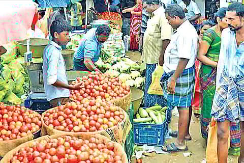 Residents buy vegetables from a market in Thoothukudi on Friday