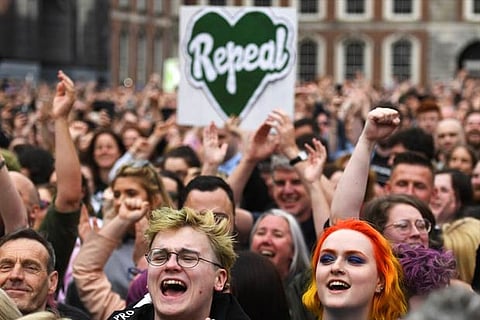 People celebrate the result of yesterday's referendum on liberalizing abortion law