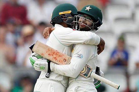 Pakistan's Imam ul-Haq (R) and Haris Sohail celebrate after winning the First Test