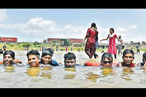 Children chill out in the Krishna water canal near Poonamallee in Chennai