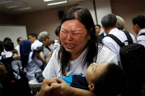 Tearful relatives of Indonesia jet crash victims demand answers