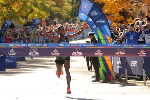 Desisa crosses the finish line to win the Professional Men's race