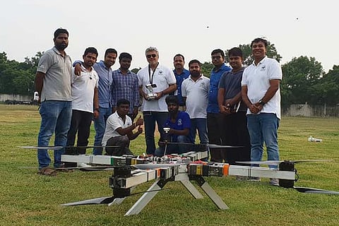 Ajith, along with the 12-member team from MIT, poses with the drone in Chennai on Tuesday