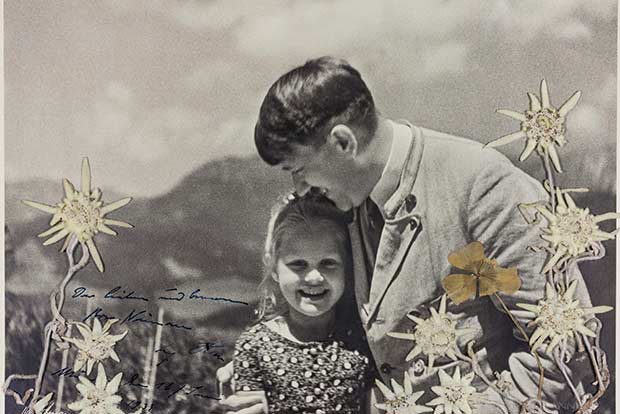 A 1933 photo of Adolf Hitler embracing 6-year-old jewish girl Rosa Bernile Nineau