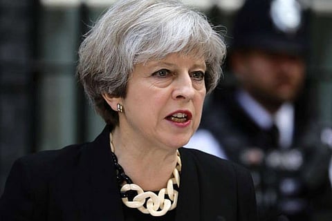 May heads to Brussels as Spain threatens Brexit summit