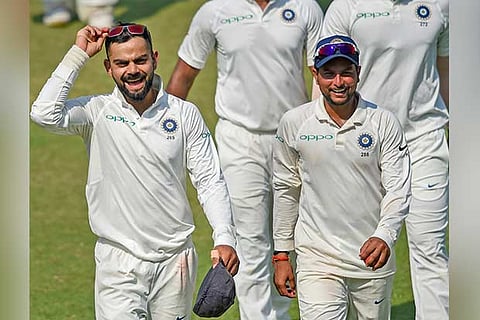 Indian team captain Virat Kohli and team player Kuldeep Yadav celebrate their victory