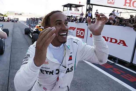Hamilton on brink of fifth title after Japan win