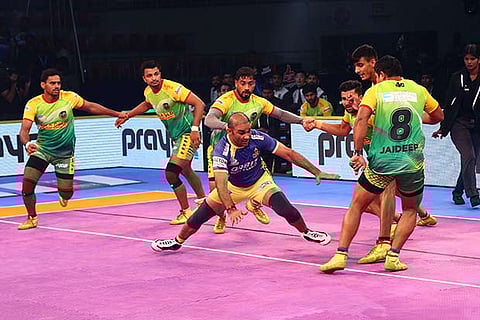 Tamil Thalaivas? raider Jasvir Singh goes for a raid against Patna Pirates in the Pro Kabaddi
