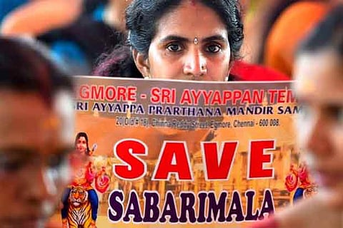 Devotees participate in an agitation against the Supreme Court's verdict on Sabarimala Temple