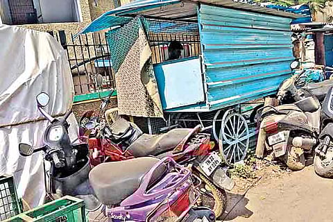 Two wheelers and small shops encroaching the road