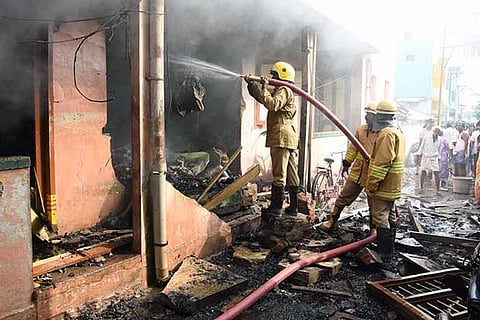 Fire tenders dousing the flames after an explosion at an illegal fire cracker manufacturing unit